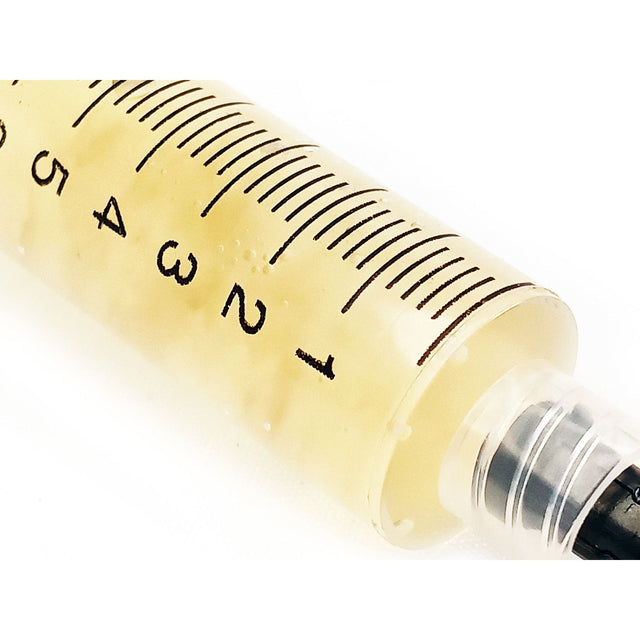 upclose mushroom liquid culture syringe